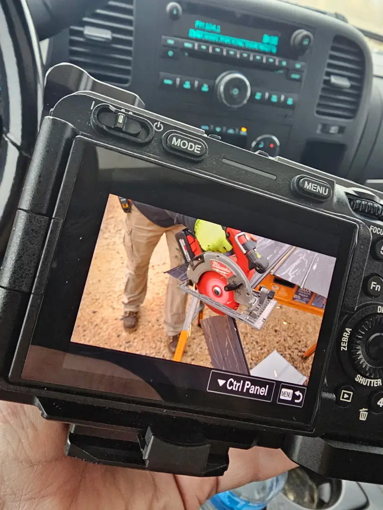 CROFT team member reviewing photos captured on their camera's LCD screen