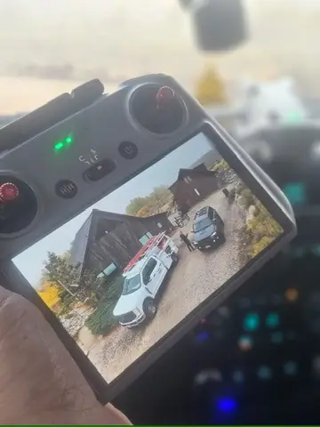 CROFT team member reviewing drone footage on their remote control LCD screen
